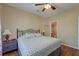 Cozy bedroom with ceiling fan, wood-look floors, and an attached bathroom at 132 Lynches River Dr, Summerville, SC 29485