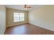 Inviting bedroom featuring wood-look floors, a ceiling fan, and natural light from a window at 132 Lynches River Dr, Summerville, SC 29485