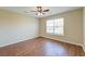 Bright bedroom with hardwood flooring, ceiling fan and natural light from the large window at 132 Lynches River Dr, Summerville, SC 29485