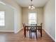 Cozy dining room with a wooden table, four chairs, and a chandelier at 132 Lynches River Dr, Summerville, SC 29485