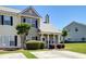 Inviting townhome with manicured lawn, mature landscaping, and a cozy front entrance at 132 Lynches River Dr, Summerville, SC 29485