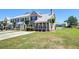 Charming townhouse with manicured lawn and a cozy front porch, perfect for relaxing outdoors at 132 Lynches River Dr, Summerville, SC 29485