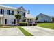 Inviting townhouse featuring a well-maintained lawn, driveway, and picturesque landscaping at 132 Lynches River Dr, Summerville, SC 29485