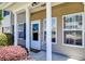 Inviting front porch with white columns and well maintained shrubs at 132 Lynches River Dr, Summerville, SC 29485