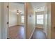Hallway view to bedroom with hardwood flooring, ceiling fan, and natural light at 132 Lynches River Dr, Summerville, SC 29485