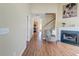 Open concept living room featuring fireplace, hardwood floors and natural light at 132 Lynches River Dr, Summerville, SC 29485