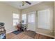 Cozy sunroom with ample natural light, desk, and backyard access at 132 Lynches River Dr, Summerville, SC 29485