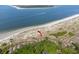 An aerial view of a condo community on the beach with ocean views and lush greenery at 1332 Pelican Watch Villas, Seabrook Island, SC 29455