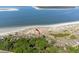 Aerial view of condo community bordering the beach, showcasing the proximity to the ocean and surrounding landscape at 1332 Pelican Watch Villas, Seabrook Island, SC 29455