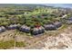 Aerial view of condo community with beach access, showcasing the location and nearby foliage at 1332 Pelican Watch Villas, Seabrook Island, SC 29455