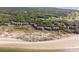 Beautiful aerial shot showcasing beachfront condos with serene ocean views and pristine sandy shores at 1332 Pelican Watch Villas, Seabrook Island, SC 29455