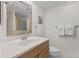 Bright bathroom features a classic vanity with a framed mirror and modern fixtures at 1332 Pelican Watch Villas, Seabrook Island, SC 29455