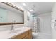 Bright bathroom features a classic vanity, shower/bath and seashell decor at 1332 Pelican Watch Villas, Seabrook Island, SC 29455