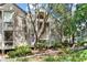 Charming exterior of the building with lush greenery and mature trees at 1332 Pelican Watch Villas, Seabrook Island, SC 29455