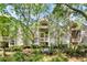 Well maintained building exterior surrounded by mature landscaping and trees at 1332 Pelican Watch Villas, Seabrook Island, SC 29455