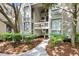 Inviting entryway with lush landscaping leading to the building entrance at 1332 Pelican Watch Villas, Seabrook Island, SC 29455