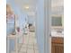 Stylish hallway with tiled floors leading to the bathroom and living area at 1332 Pelican Watch Villas, Seabrook Island, SC 29455