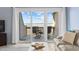 View from living room onto balcony showing outdoor furniture and a nice view of the water at 1332 Pelican Watch Villas, Seabrook Island, SC 29455