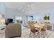 Bright living area with tile flooring, dining table, and comfortable seating at 1332 Pelican Watch Villas, Seabrook Island, SC 29455