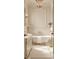 This elegant bathroom has a standalone tub with gold accents and classic white tiling at 134 Spring St, Charleston, SC 29403