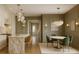 Elegant kitchen and dining area with modern lighting and stylish green chairs at 134 Spring St, Charleston, SC 29403