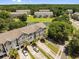 Lovely aerial view of townhomes with private parking, beautiful landscaping, and a serene pond at 1349 Hamlin Park Cir, Mount Pleasant, SC 29466