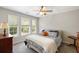 Inviting bedroom with three bright windows, soft carpet, and ceiling fan at 1349 Hamlin Park Cir, Mount Pleasant, SC 29466