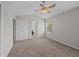 This carpeted bedroom includes a ceiling fan, window, and double door closet at 1349 Hamlin Park Cir, Mount Pleasant, SC 29466