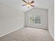 This carpeted bedroom includes a ceiling fan and large window for optimal space at 1349 Hamlin Park Cir, Mount Pleasant, SC 29466