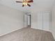 This carpeted bedroom includes a ceiling fan and double door closet for optimal space at 1349 Hamlin Park Cir, Mount Pleasant, SC 29466