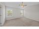 This carpeted bedroom includes a ceiling fan and two large windows for natural light at 1349 Hamlin Park Cir, Mount Pleasant, SC 29466