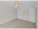 This carpeted bedroom includes a ceiling fan and large closet for optimal space at 1349 Hamlin Park Cir, Mount Pleasant, SC 29466