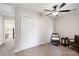 Clean bright bedroom with closet space and dark ceiling fan at 1349 Hamlin Park Cir, Mount Pleasant, SC 29466