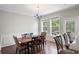 Dining area featuring hardwood floors, a chandelier, and a view to the outdoor deck and trees at 1349 Hamlin Park Cir, Mount Pleasant, SC 29466