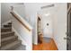 Charming foyer features gleaming hardwood floors, coat rack, and a staircase leading to the upper level at 1349 Hamlin Park Cir, Mount Pleasant, SC 29466