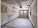 A bare garage awaits with bright lighting and a neutral painted door at 1349 Hamlin Park Cir, Mount Pleasant, SC 29466
