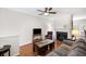 Cozy living room with a fireplace, hardwood floors, and comfortable furnishings, perfect for relaxation at 1349 Hamlin Park Cir, Mount Pleasant, SC 29466