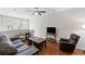 Upstairs living room featuring hardwood floors, a ceiling fan, and natural light from the nearby windows at 1349 Hamlin Park Cir, Mount Pleasant, SC 29466