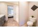 Bathroom featuring a shower, toilet, and a vanity with wood-look flooring at 1358 Givhans Rd, Ridgeville, SC 29472