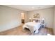 Well-lit bedroom with wood flooring, featuring stylish décor and access to the bathroom at 1358 Givhans Rd, Ridgeville, SC 29472