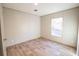 Bright bedroom with wood-look floors and natural light from the window at 1358 Givhans Rd, Ridgeville, SC 29472