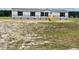 Charming single-story home with gray siding, a covered front porch, and a spacious yard at 1358 Givhans Rd, Ridgeville, SC 29472