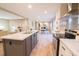 Well-equipped kitchen showcasing an island with seating, modern appliances, and views of the living spaces at 1358 Givhans Rd, Ridgeville, SC 29472