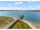 Breathtaking aerial view showcasing a pier, coastal scenery, and tranquil waters on a sunny day at 137 Low Tide Ct, Charleston, SC 29492