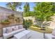 Lush backyard with patio, privacy fence, outdoor furniture, and string lights at 137 Low Tide Ct, Charleston, SC 29492
