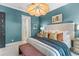 Bedroom with wooden furniture, decorative lighting, and en-suite bathroom at 137 Low Tide Ct, Charleston, SC 29492