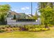 Community entrance sign amongst vibrant flowers and manicured greenery at 137 Low Tide Ct, Charleston, SC 29492