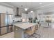 Open kitchen with stainless steel appliances, quartz counters, and an island with bar seating at 137 Low Tide Ct, Charleston, SC 29492