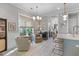 Bright living room featuring comfortable chairs, large windows, and stylish decor at 137 Low Tide Ct, Charleston, SC 29492