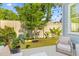 Inviting patio area featuring cozy seating, potted plants, and string lights, perfect for outdoor relaxation at 137 Low Tide Ct, Charleston, SC 29492